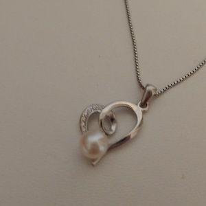 Silver, pearl, and crystal necklace